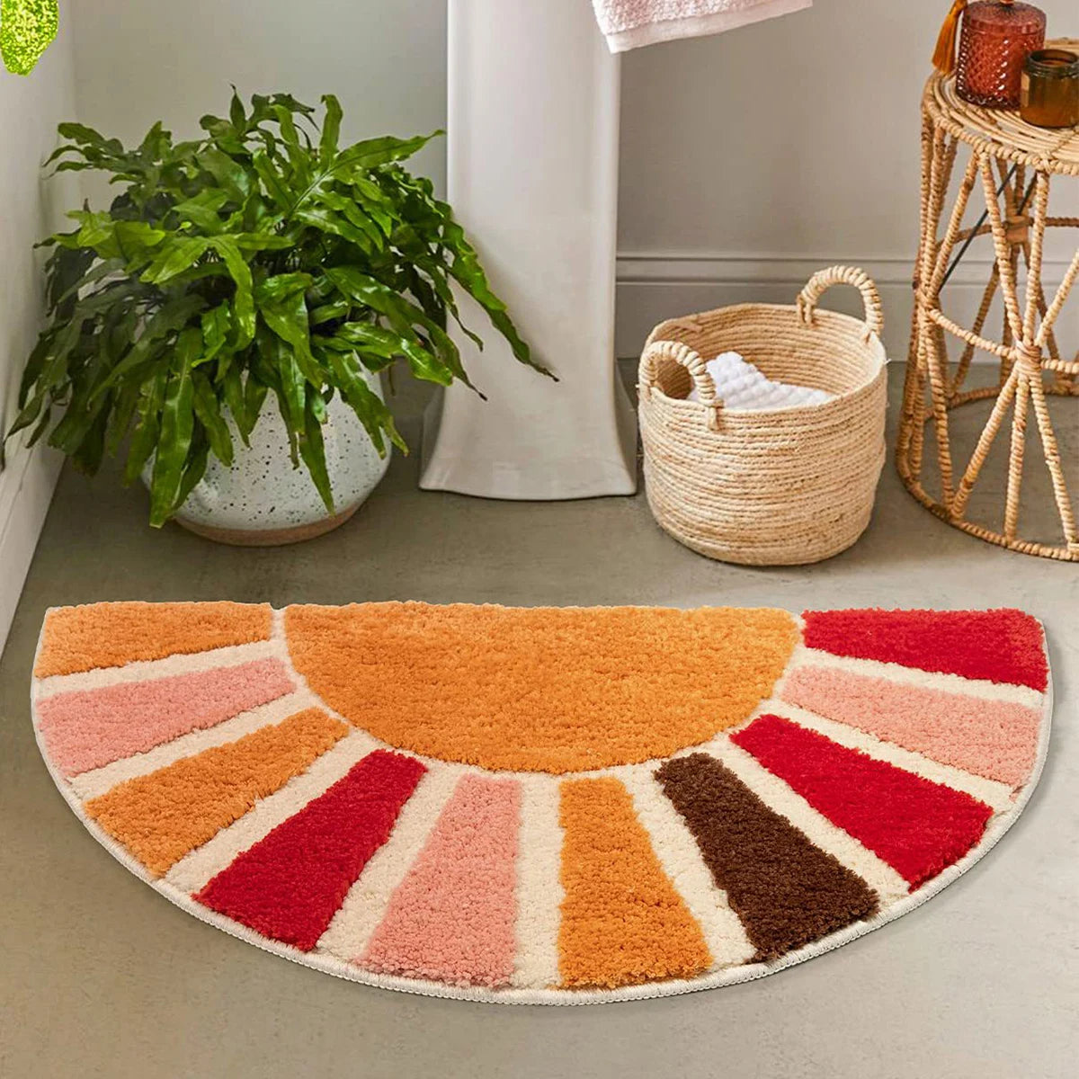 Colorful half-circle rug on a floor with a plant and basket in the background boho home decor, sunflower door mat, half circle rug, plush entry mat, non-slip bath mat, boho floor mat, floral floor rug, bathroom rug, farmhouse decor, cozy home gift, housewarming gift, living room mat, pastel home accents, cute doormat