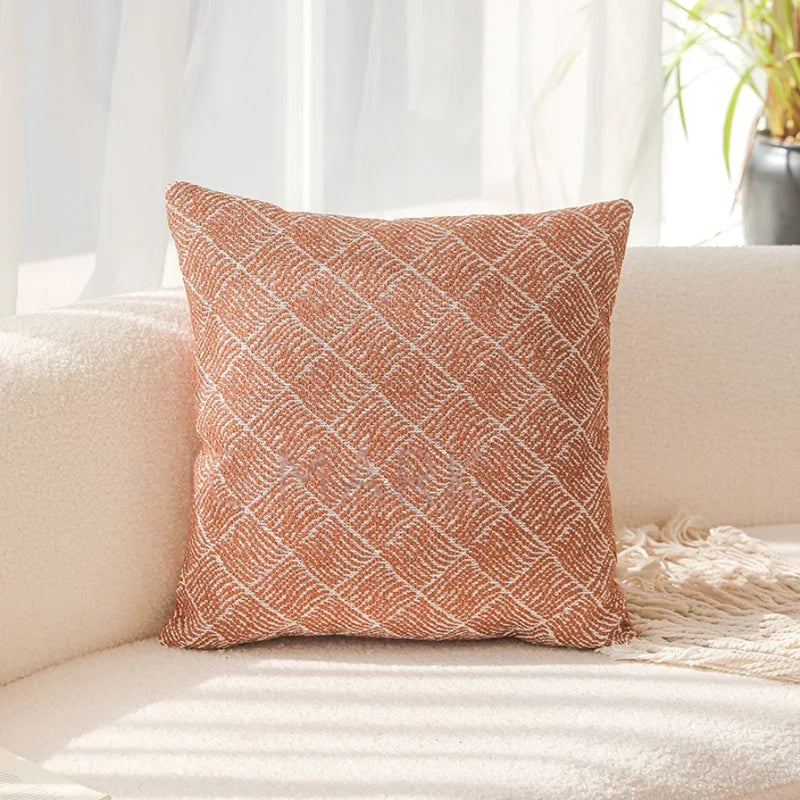 Patterned pillow on a beige sofa with a light background. Decorative pillow Modern yarn-dyed throw pillow cover, luxury textured decorative cushion for sofa, bed, or window seating in soft neutral tones.
